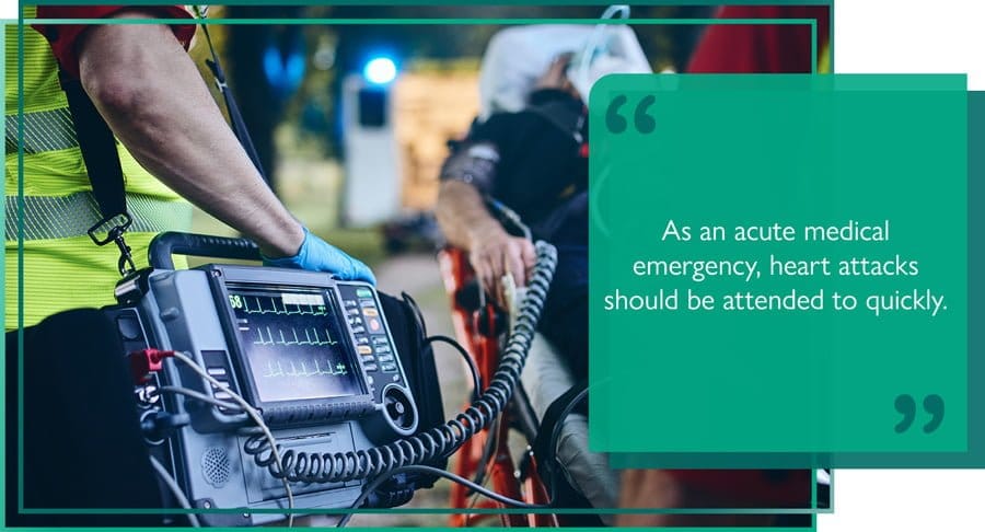 Paramedic monitoring a patient's vital signs